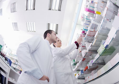 team of pharmacist chemist woman and man group standing in pharmacy drugstore team of pharmacist chemist woman and man group standing in pharmacy drugstore